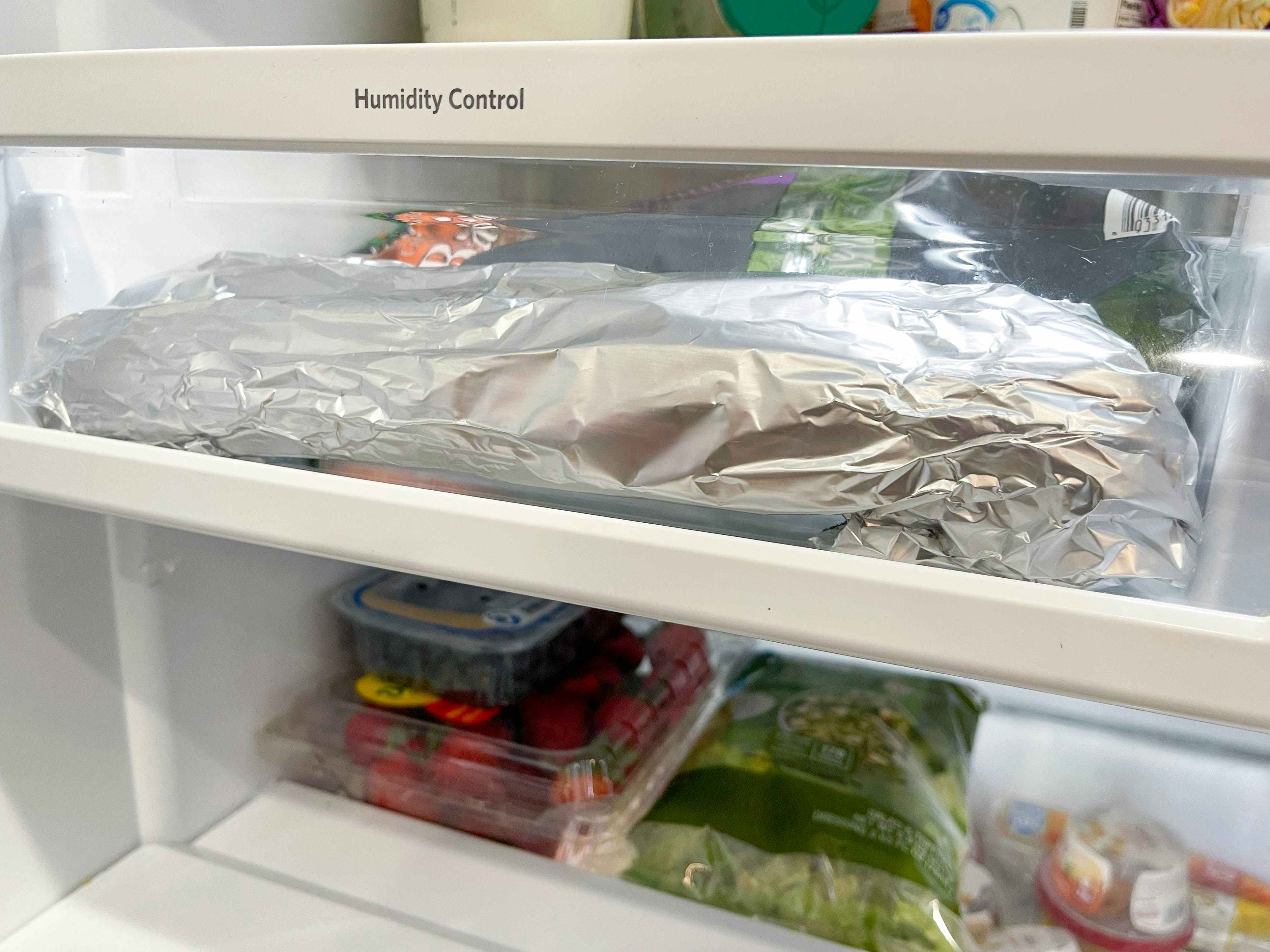 celery wrapped in foil in fridge crisper drawer