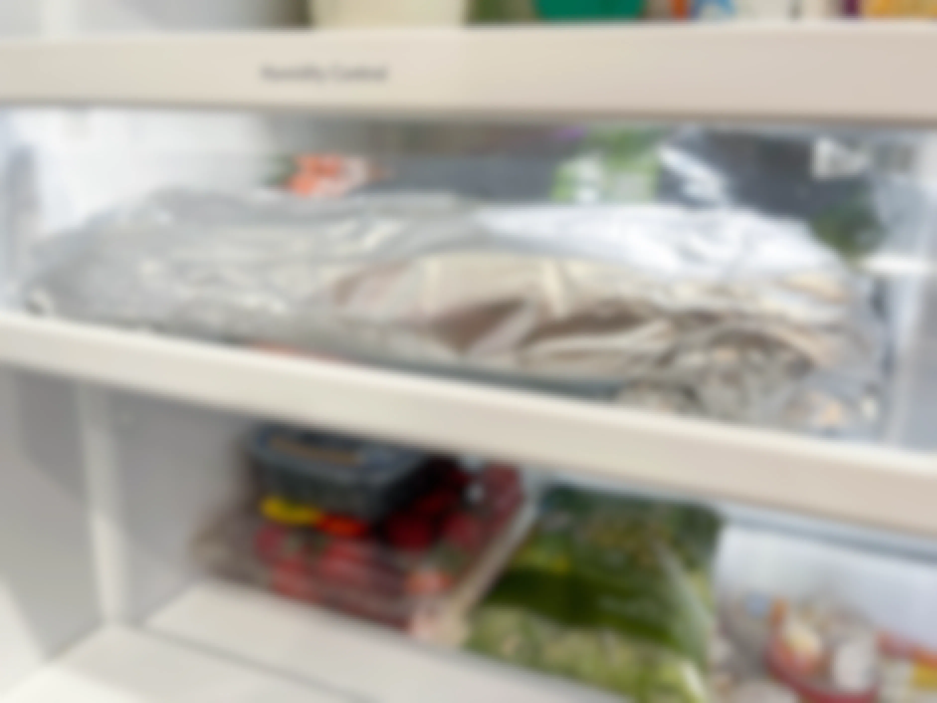 celery wrapped in foil in fridge crisper drawer