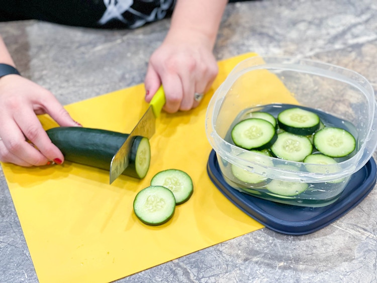 cucumber being sliced