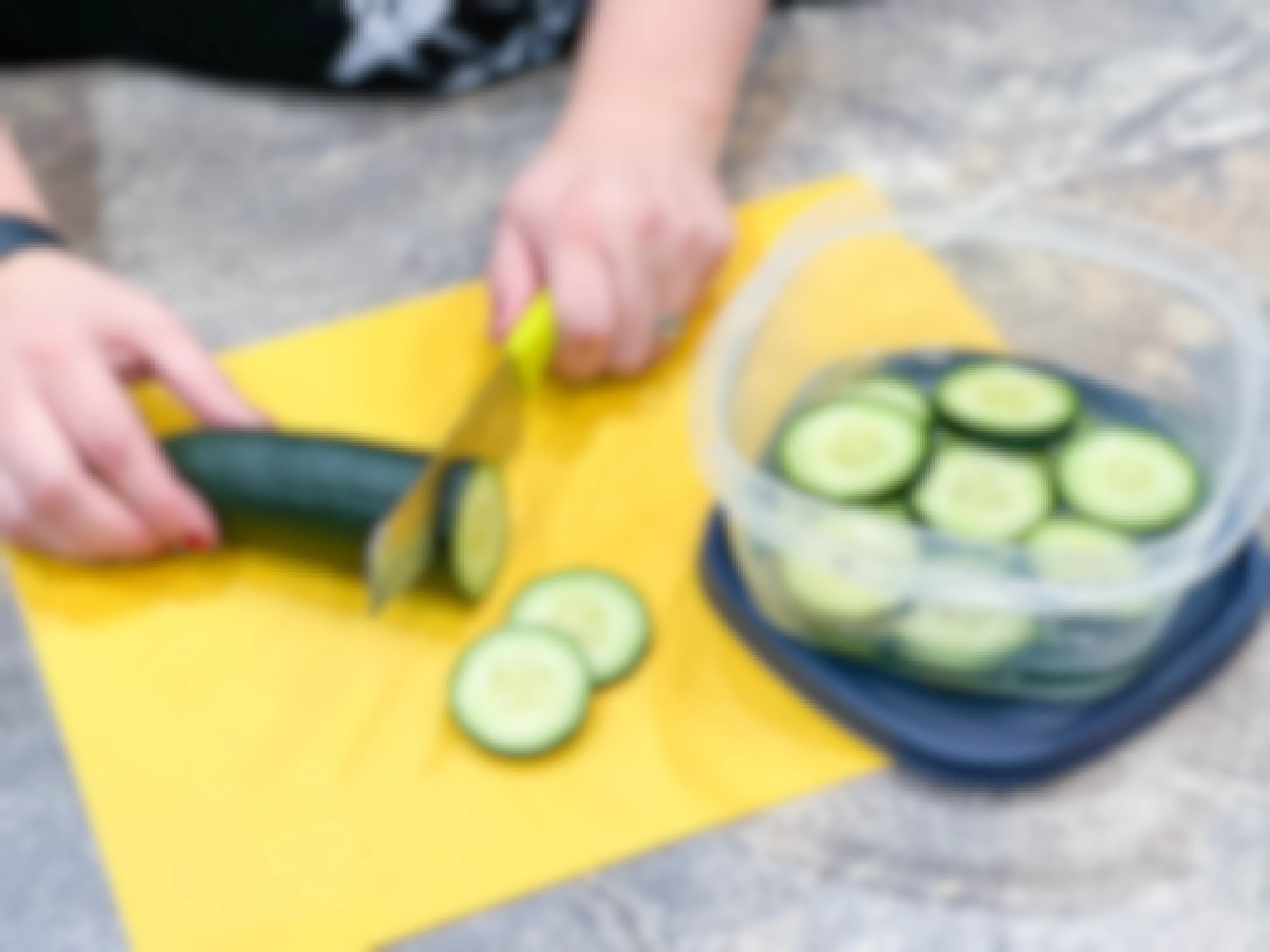 cucumber being sliced
