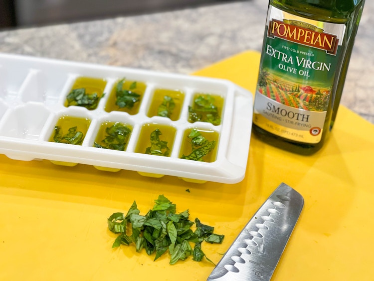 olive oil and basil in ice cube trays