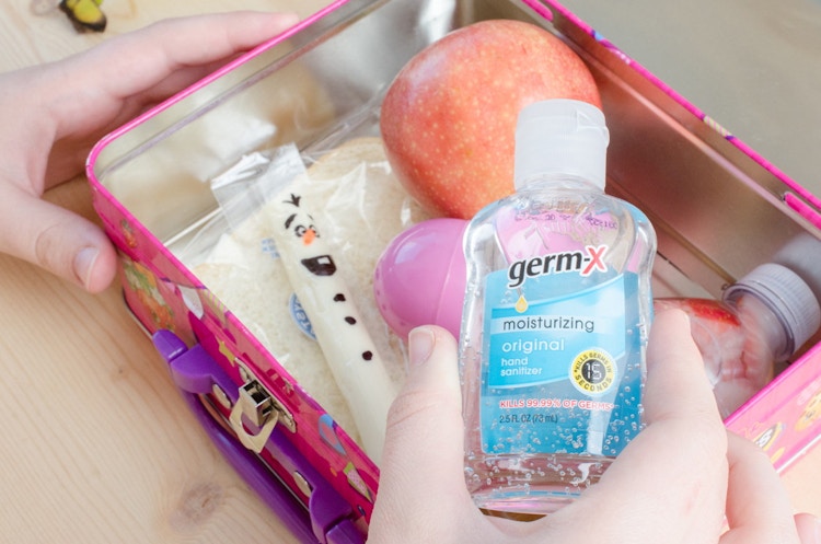 Pack travel-sized hand sanitizer