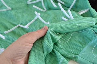 Gather green clothes and sew on pipe cleaners for a prickly cactus.