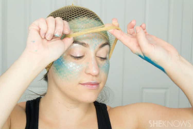 Apply makeup over a fishnet stocking to achieve a mermaid look.