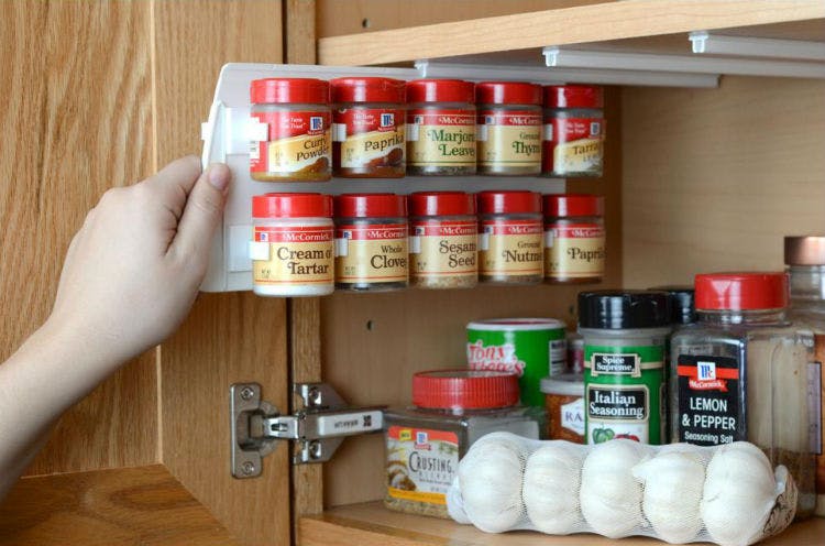 Install a pull out spice rack to the underside of a cabinet.