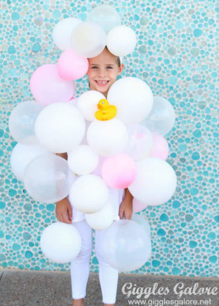 Pin white, clear, and pink balloons to a white outfit and go as a bubble bath.