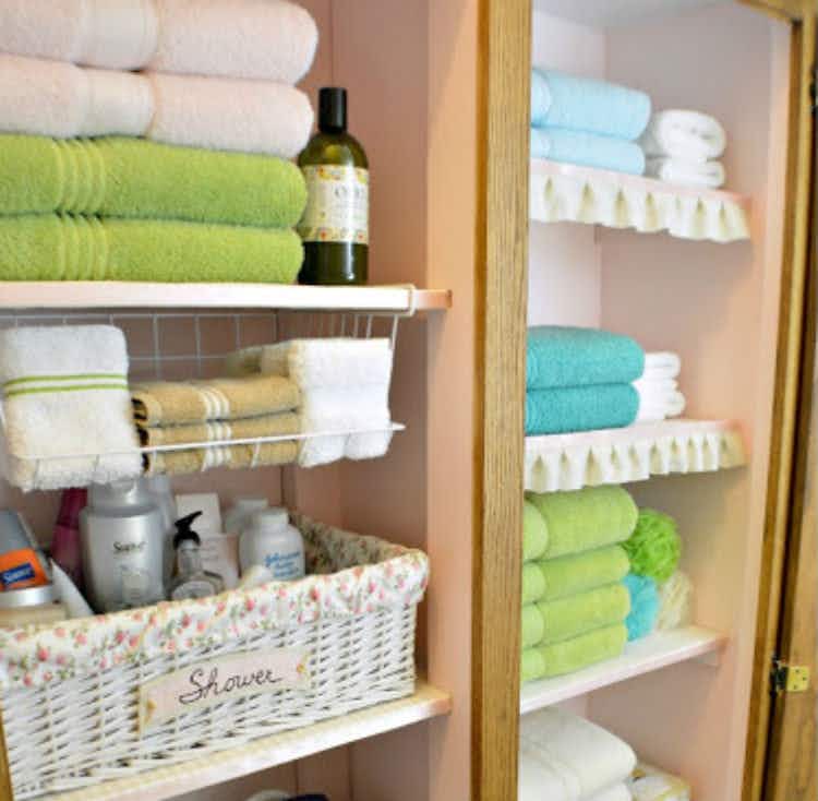 Install an under-shelf basket for hand towels.
