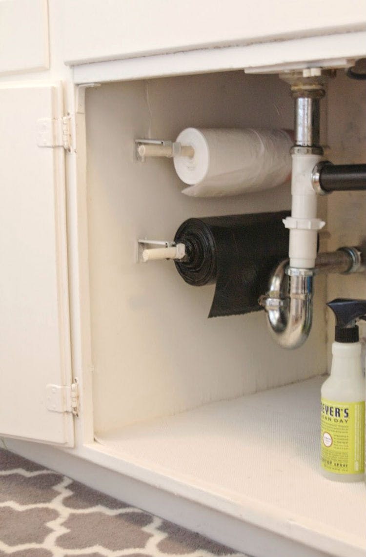 Hang up bulky trash bag rolls.