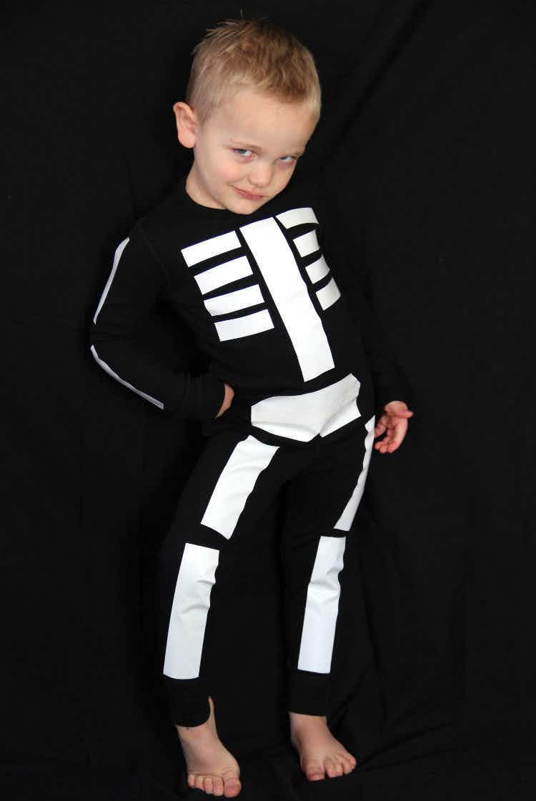 Mark all-black clothes with white tape and go as a skeleton.