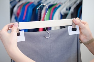 Avoid hanger creases in pants with business cards.