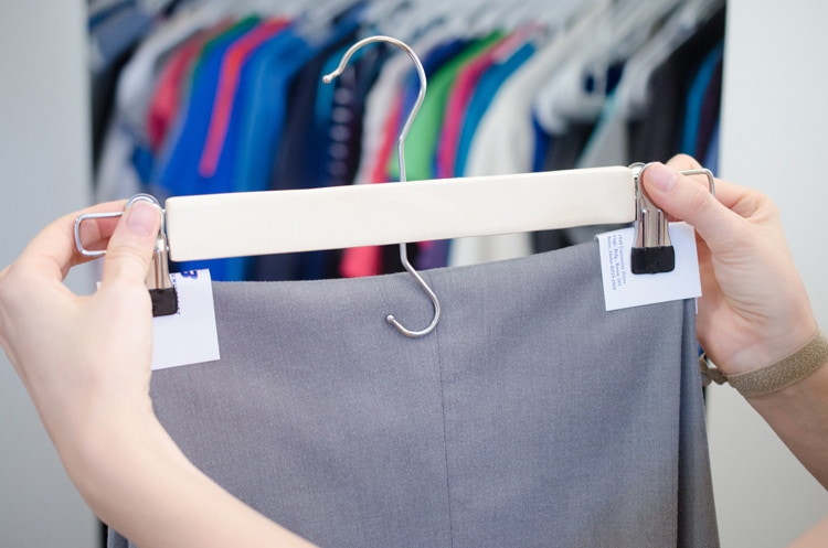Avoid hanger creases in pants with business cards.