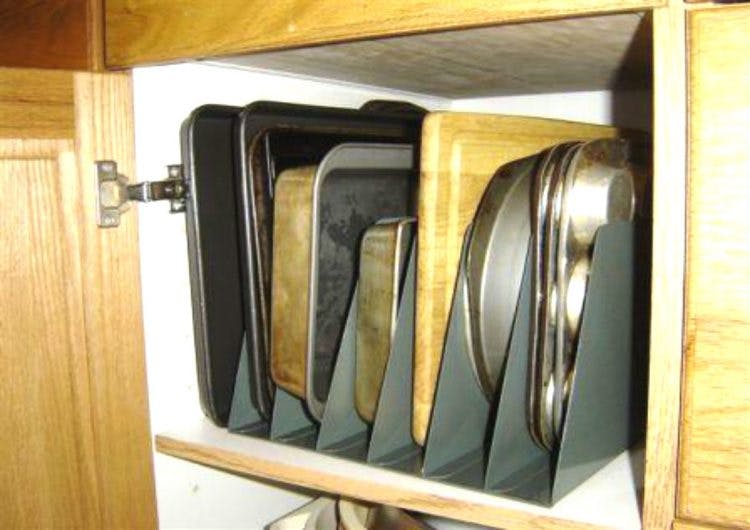 Store baking sheets and cutting boards in metal file holders.