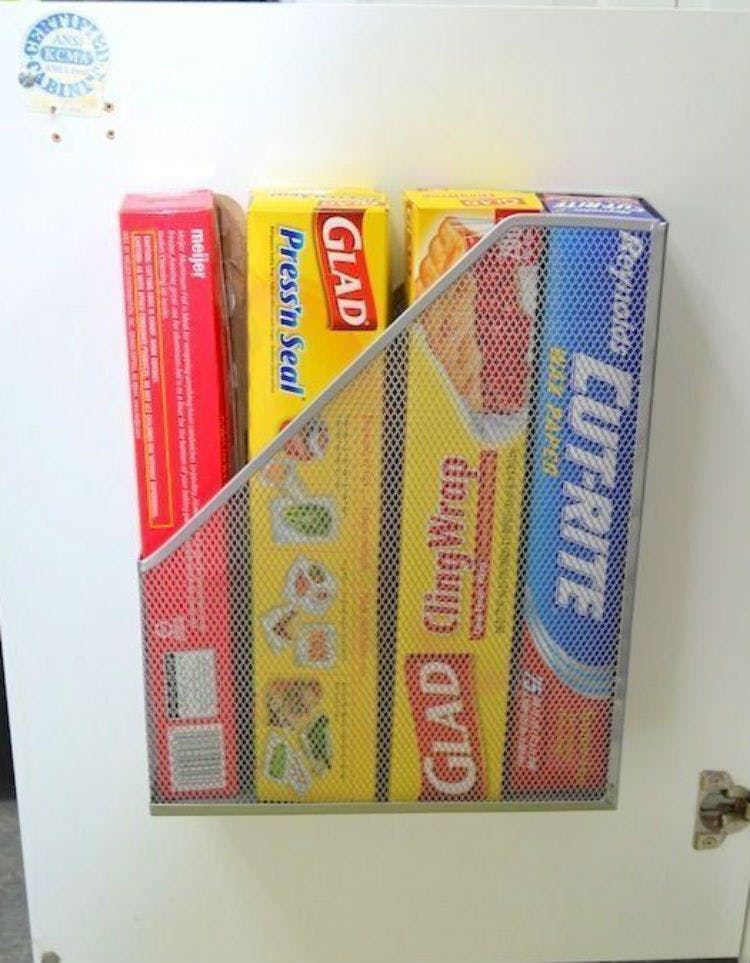 Mount a file holder to the inside of a cabinet door.
