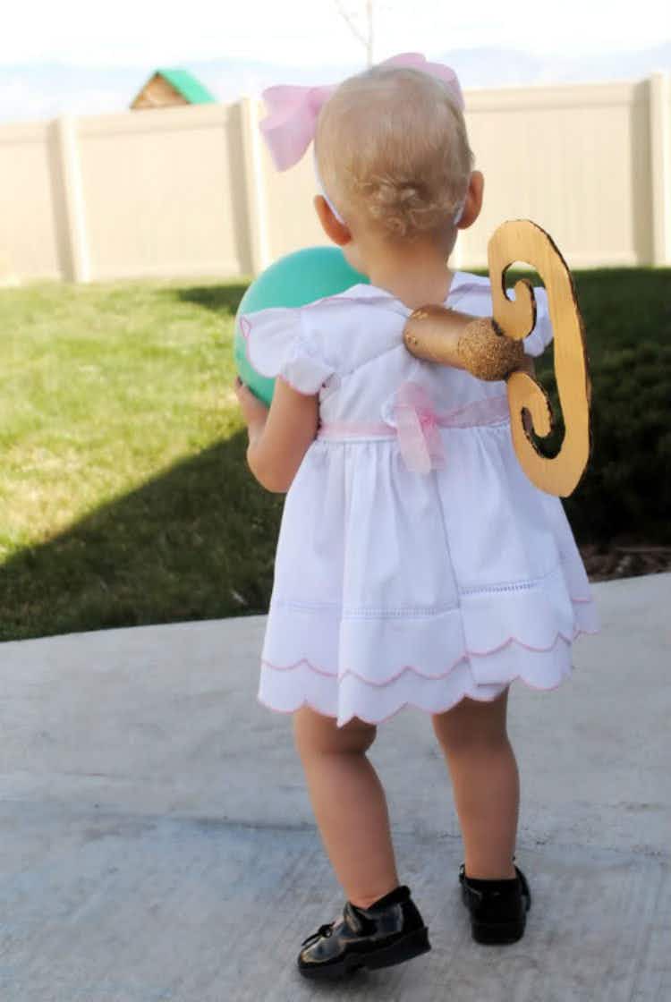 Use a toilet paper roll, a styrofoam ball, and cardboard for a wind-up doll costume.