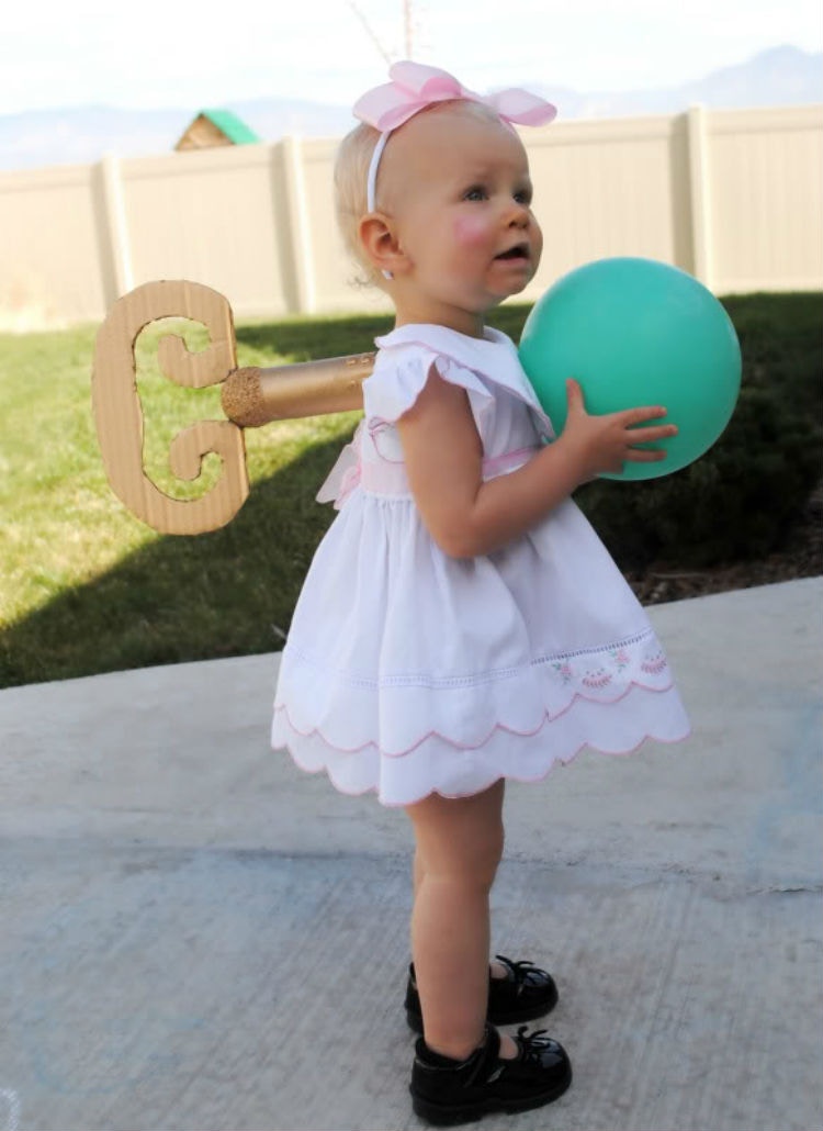 Use a toilet paper roll, a styrofoam ball, and cardboard for a wind-up doll costume.