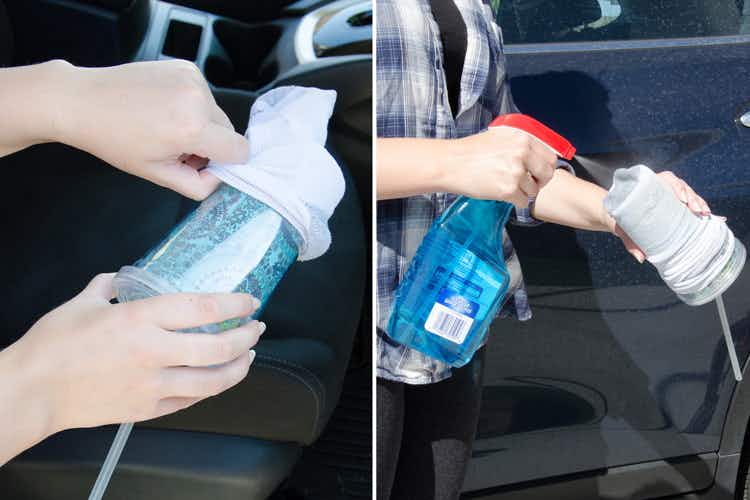 someone using an old sock, Windex, and a travel cup to clean cup holders in their car.