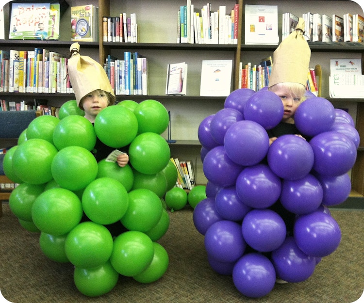 Attach balloons to a pillowcase for grapes.