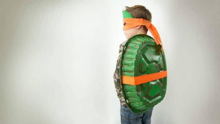 Attach a painted baking pan to your child's back and turn him or her into a TMNT.