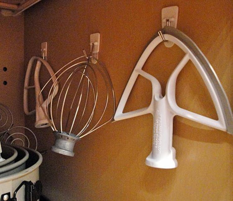 Hang KitchenAid accessories from hooks.