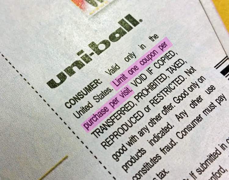 A close up on a Uniball coupon showing the fine print highlighted which says, "Limit one coupon per purchase per visit