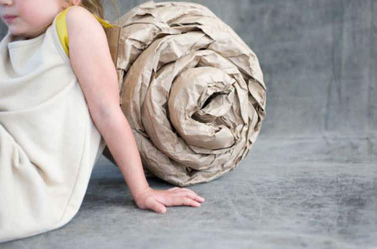 Roll up brown craft paper into a snail shell and put it on your child's back