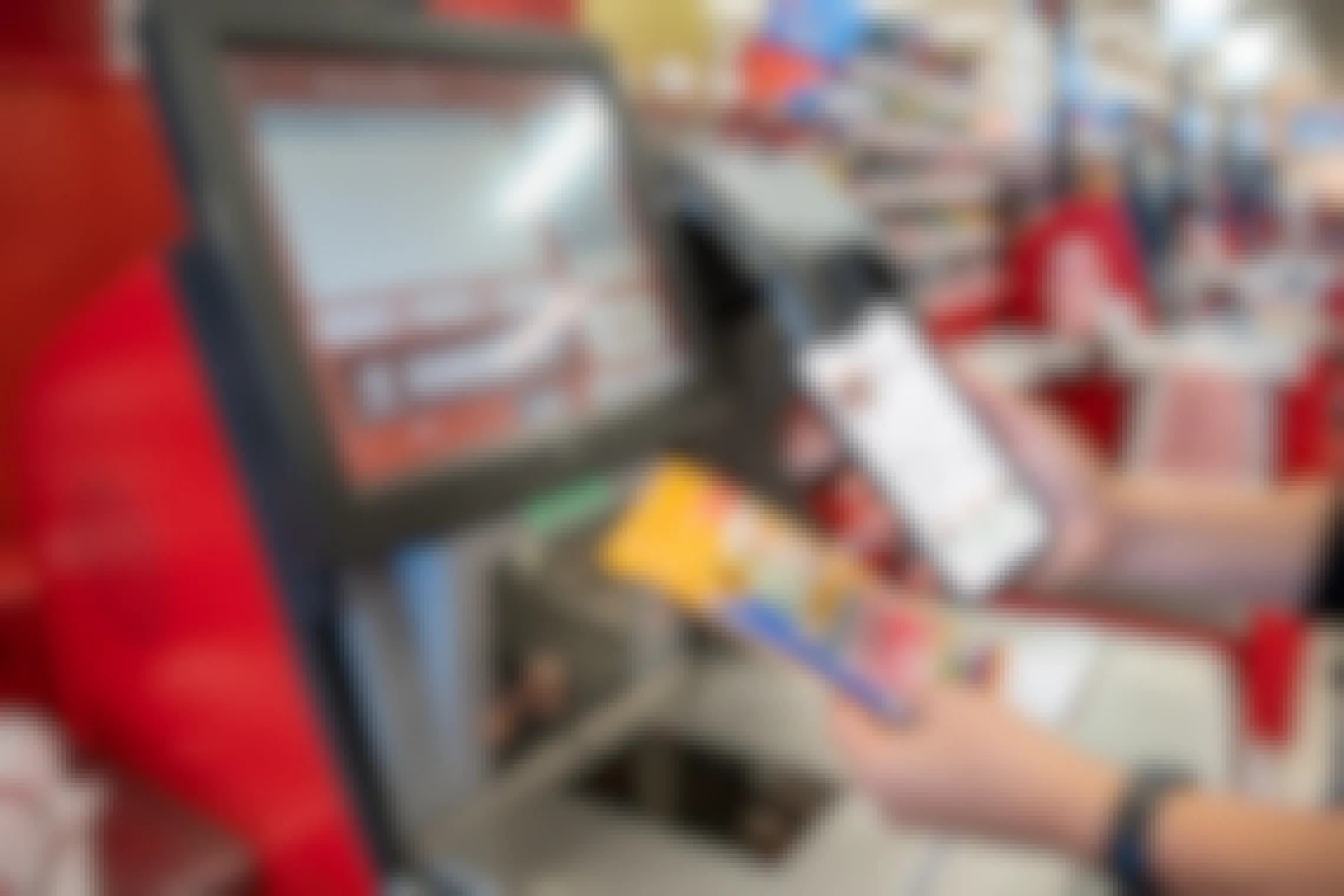 A person holding their phone next to a pack of BIC mechanical pencils at the self-checkout scanner inside Target.