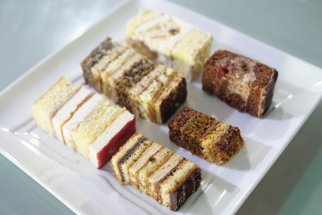 A plate of different wedding cake samples.