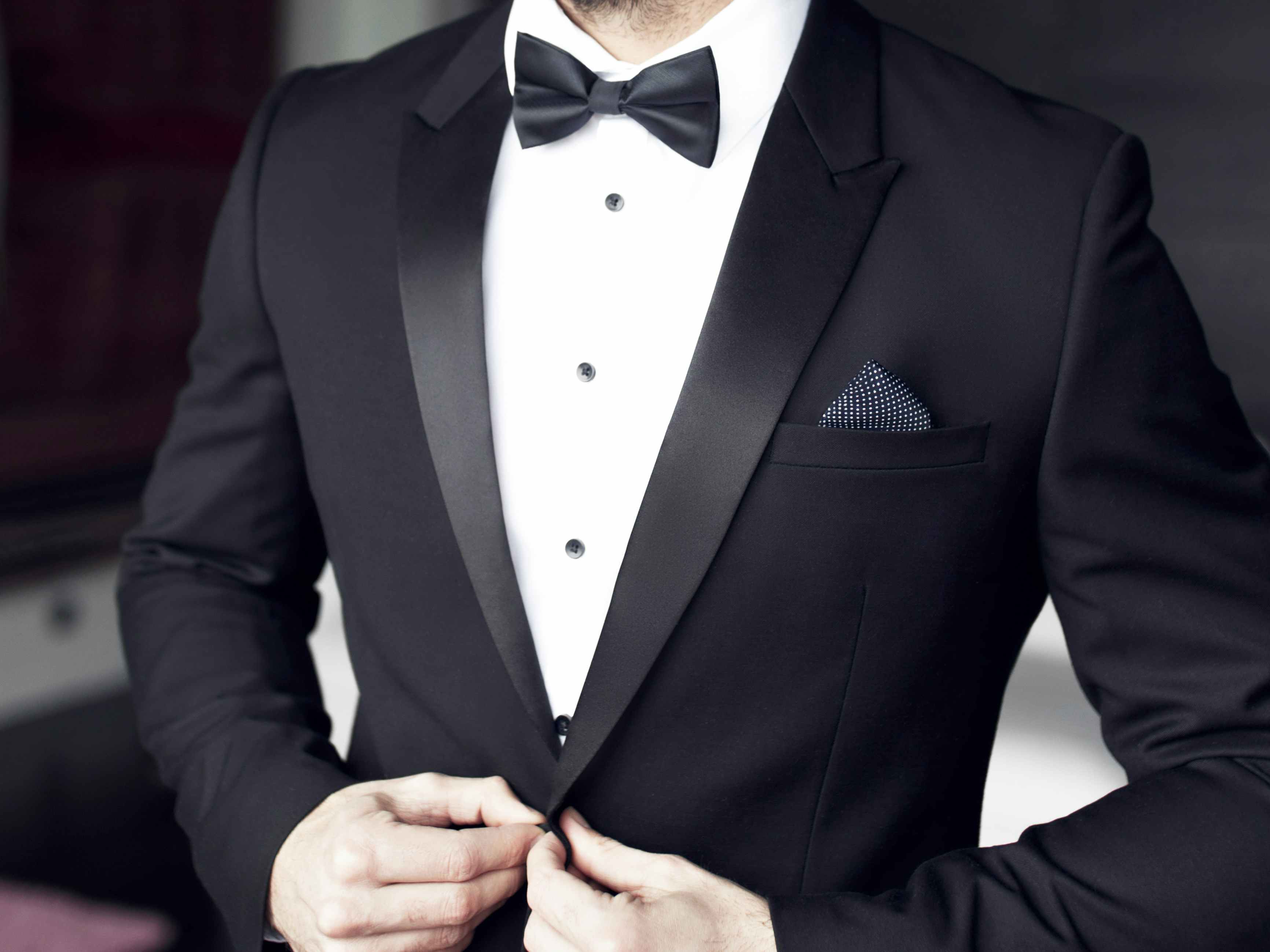 a person in a tuxedo and bow tie