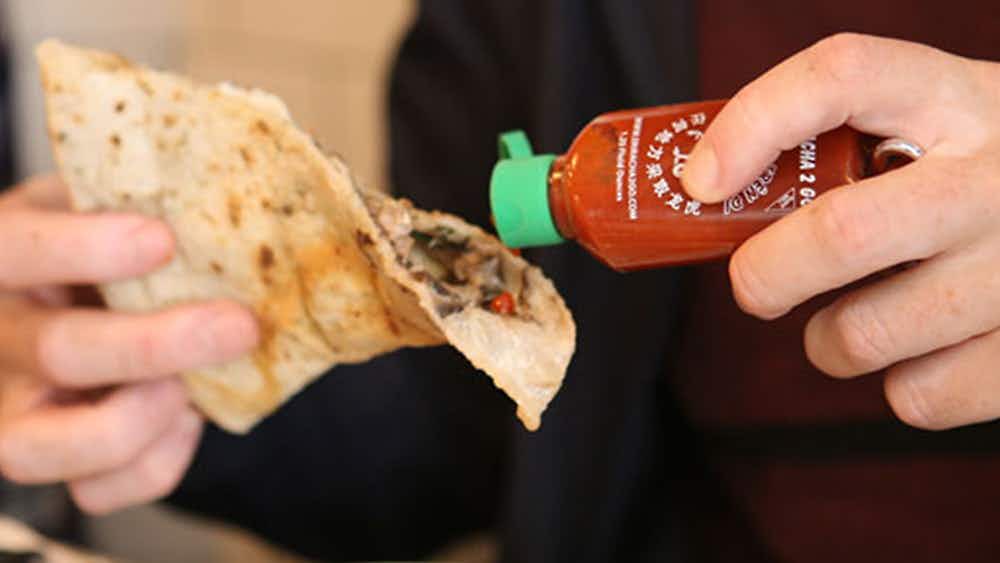 Buy a sriracha key chain and add some flavor to your popcorn, nachos, or pizza.