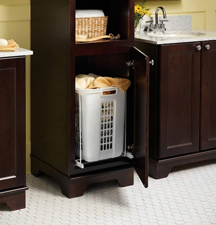 Install a bottom pull-out shelf for a laundry basket.