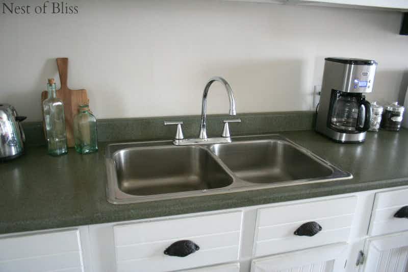 Spray paint your countertop a faux granite.