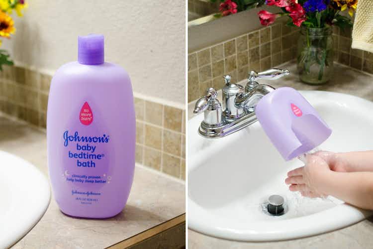 A bottle of Johnson & Johnson Baby Bedtime Bath next to a child washing their hands from a sink with a cutoff bottle as a faucet extender.