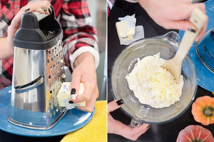 Someone grating a stick of butter and mixing it into a bowl with ingredients for a pie crust.
