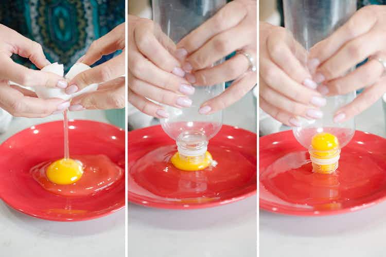 A person separating an egg yolk from whites using a plastic bottle.