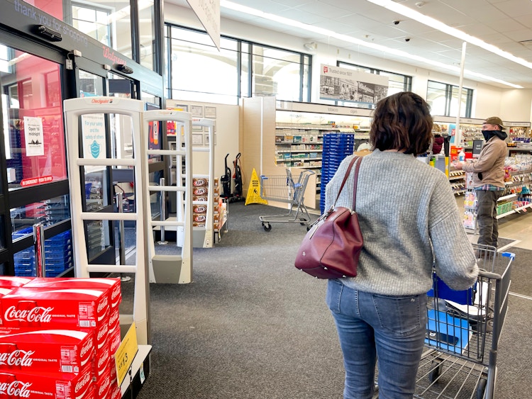 woman walking into walgreens
