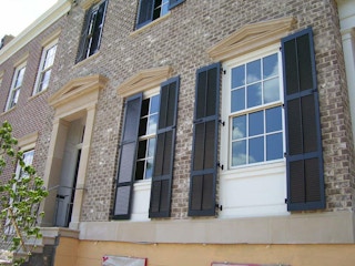 Install decorative shutters around your windows.