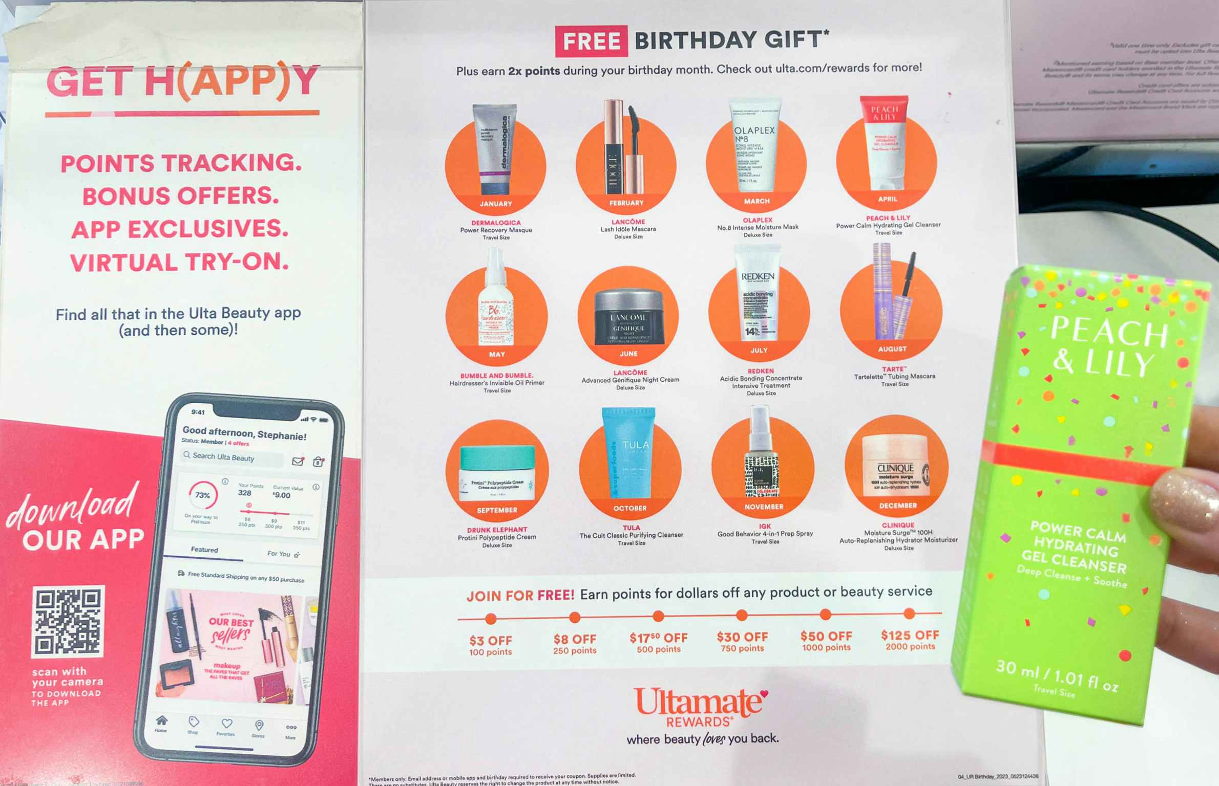 a person holding a birthday freebie in ulta in front of the store birthday sign