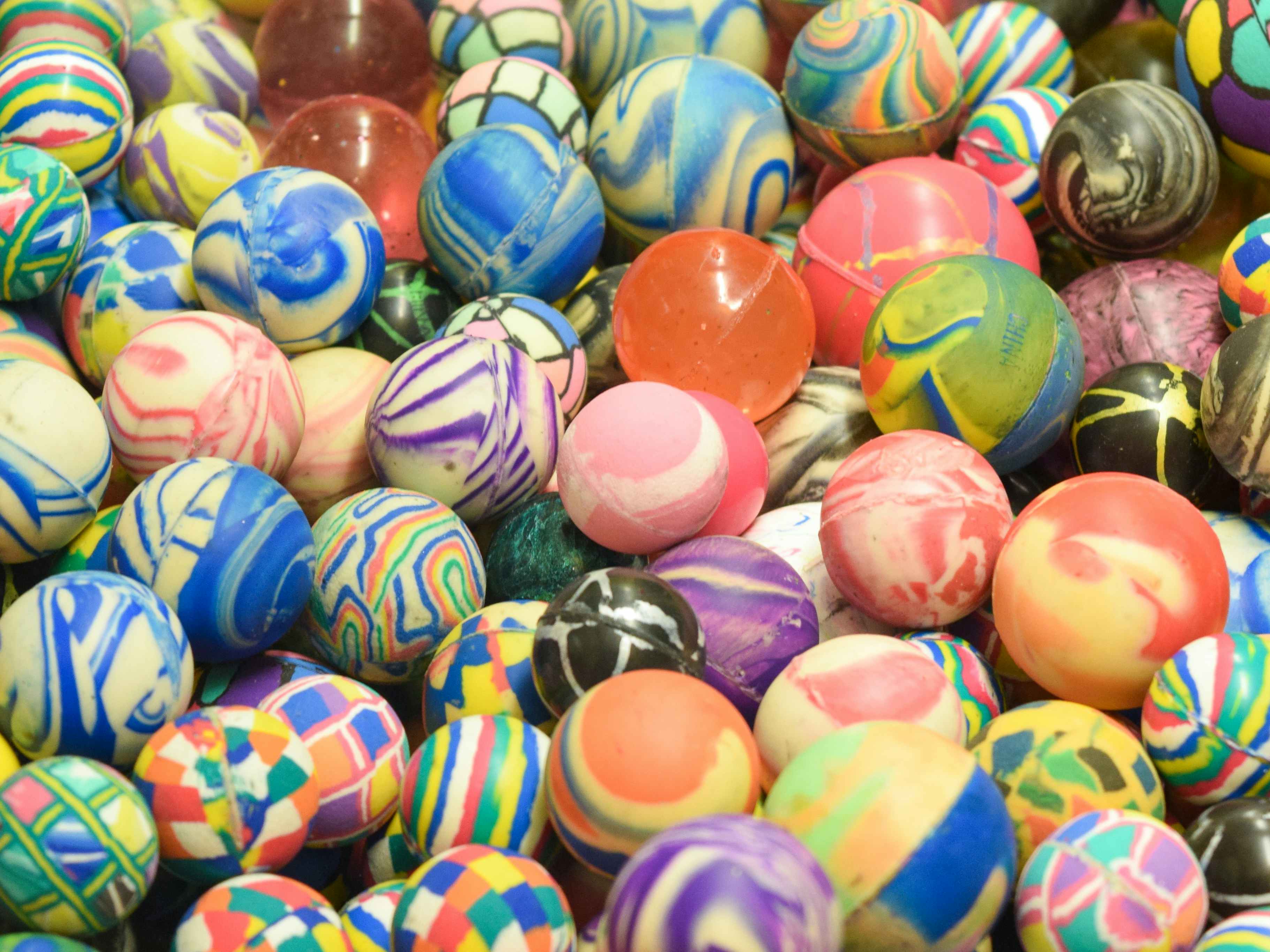 A close up on a huge pile of colorful bouncy balls.