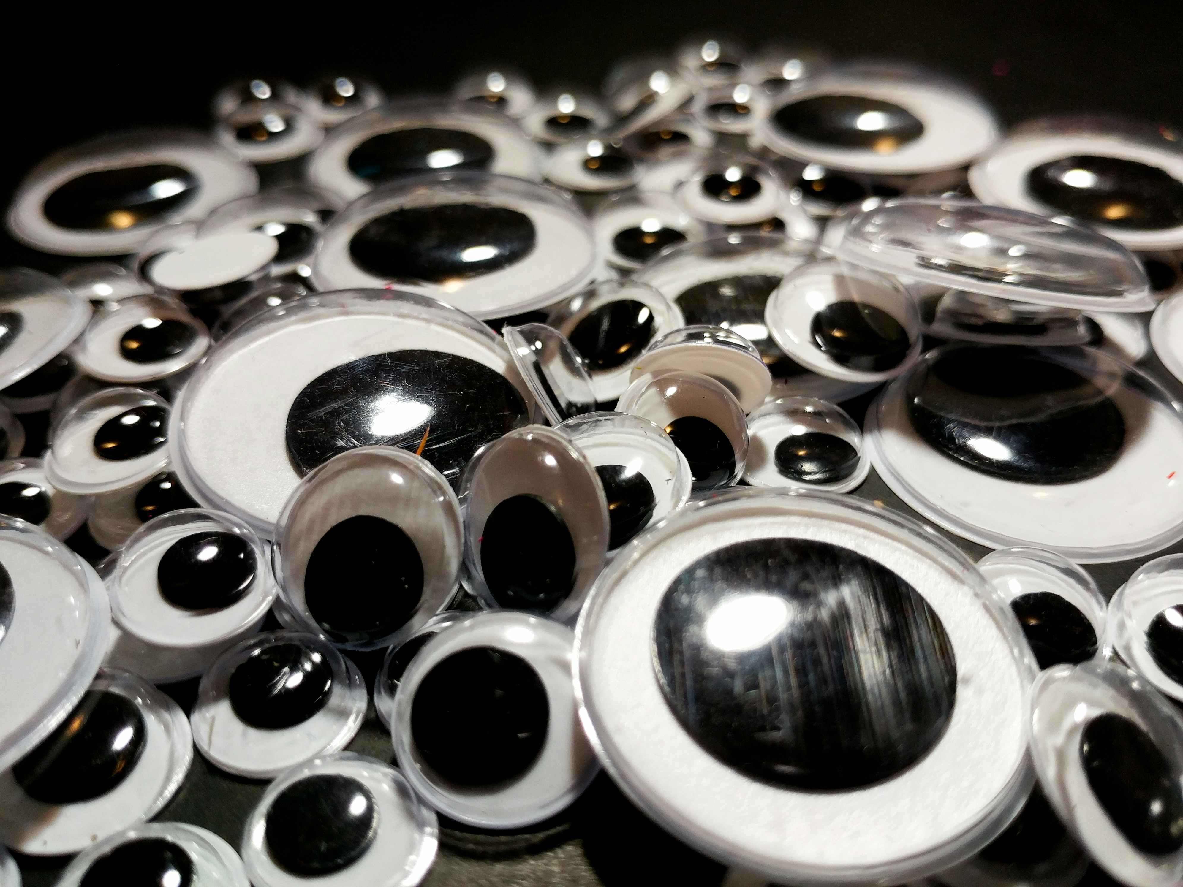 A huge pile of different sized googly eyes.