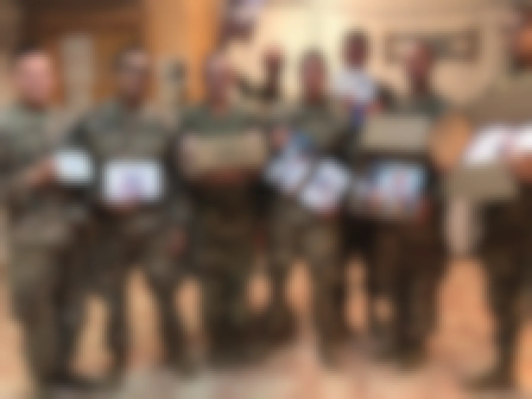 Army soldiers holding care packages from Operation Shoebox New Jersey