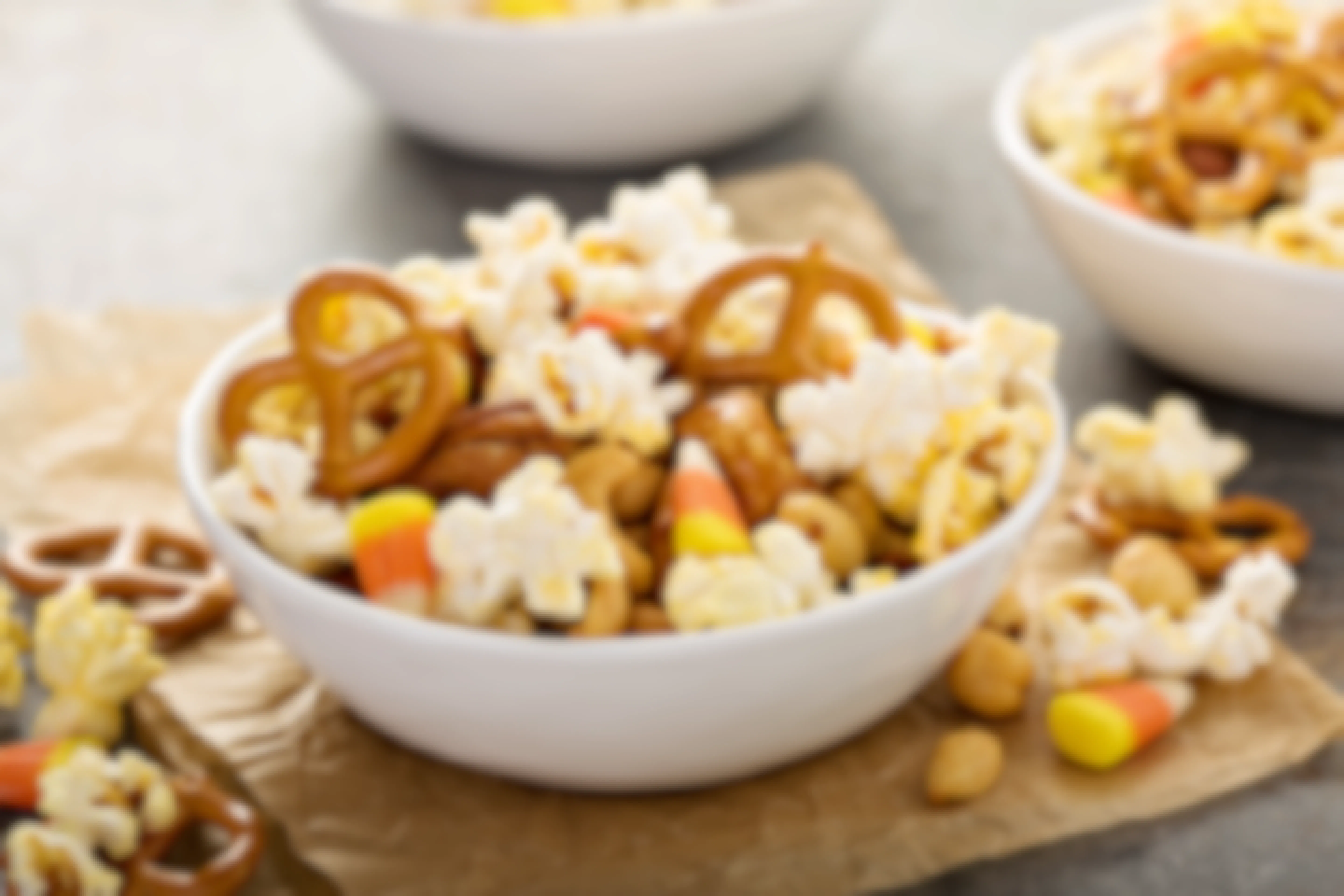 A homemade trail mix made with popcorn, pretzels, and leftover Halloween candy.