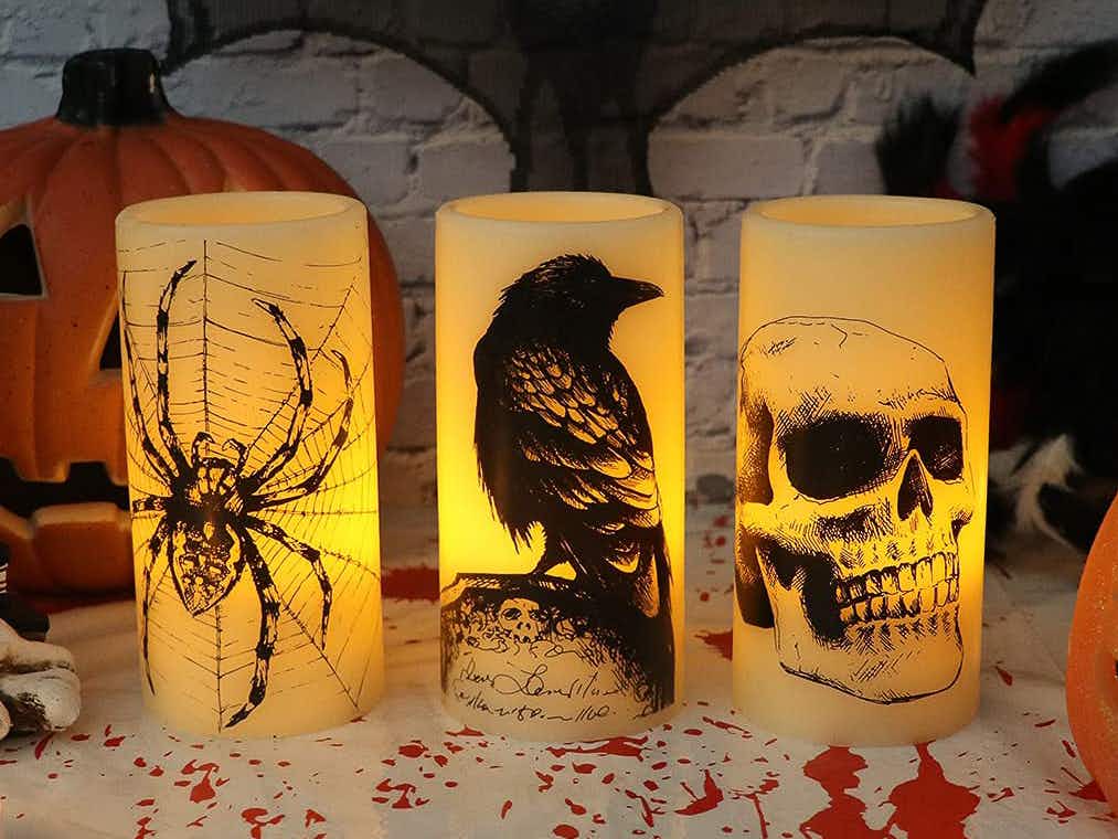 Decorative Halloween pillar candles on a table