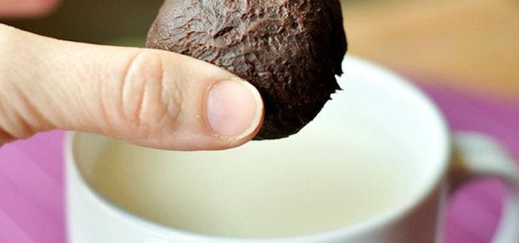 Drop hot chocolate balls into a warm mug of milk.