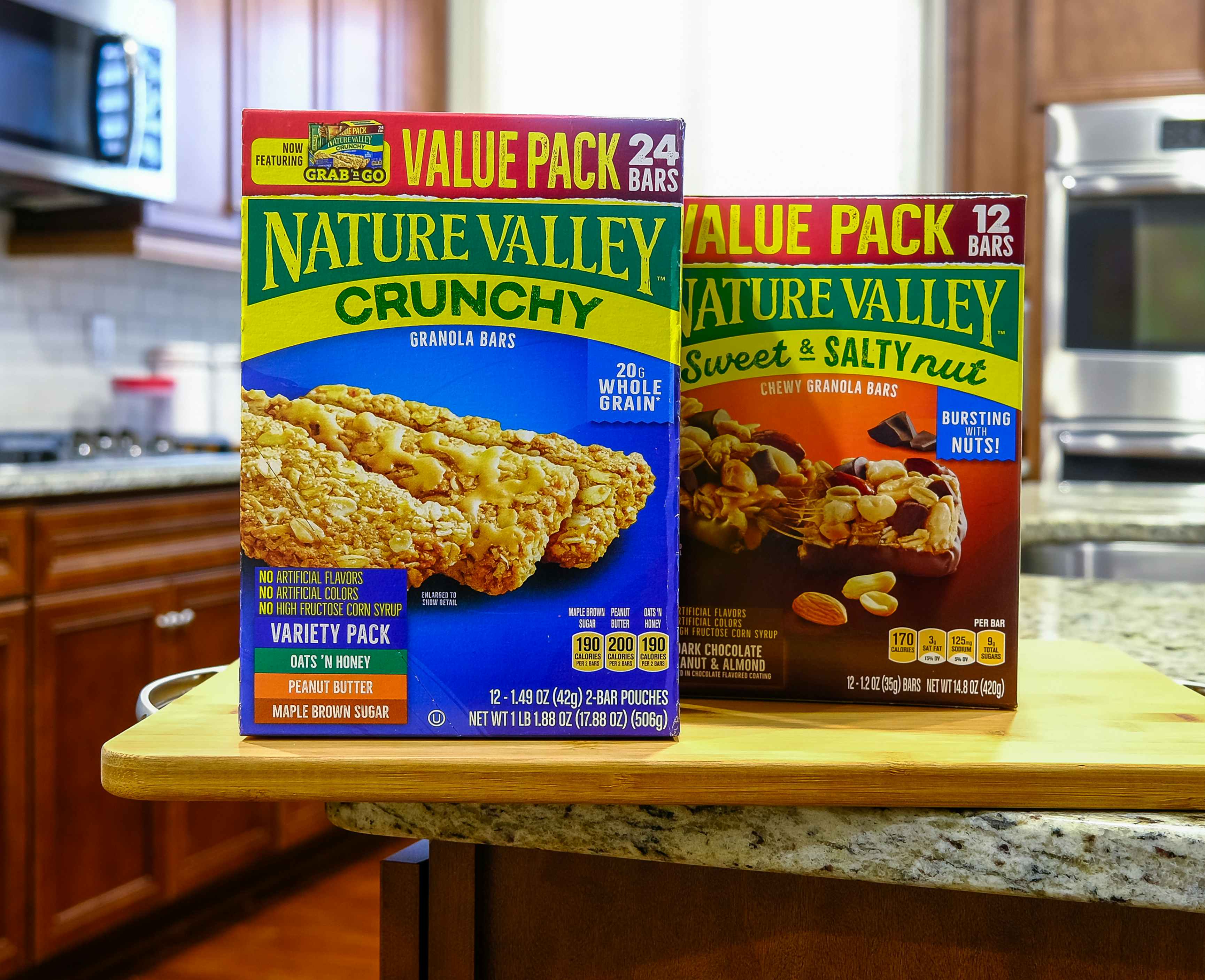 Two boxes of Nature Valley bars sitting on a kitchen counter.