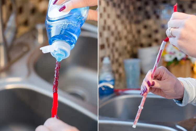 Person cleaning a straw with a pipe cleaner and Dawn dish soap