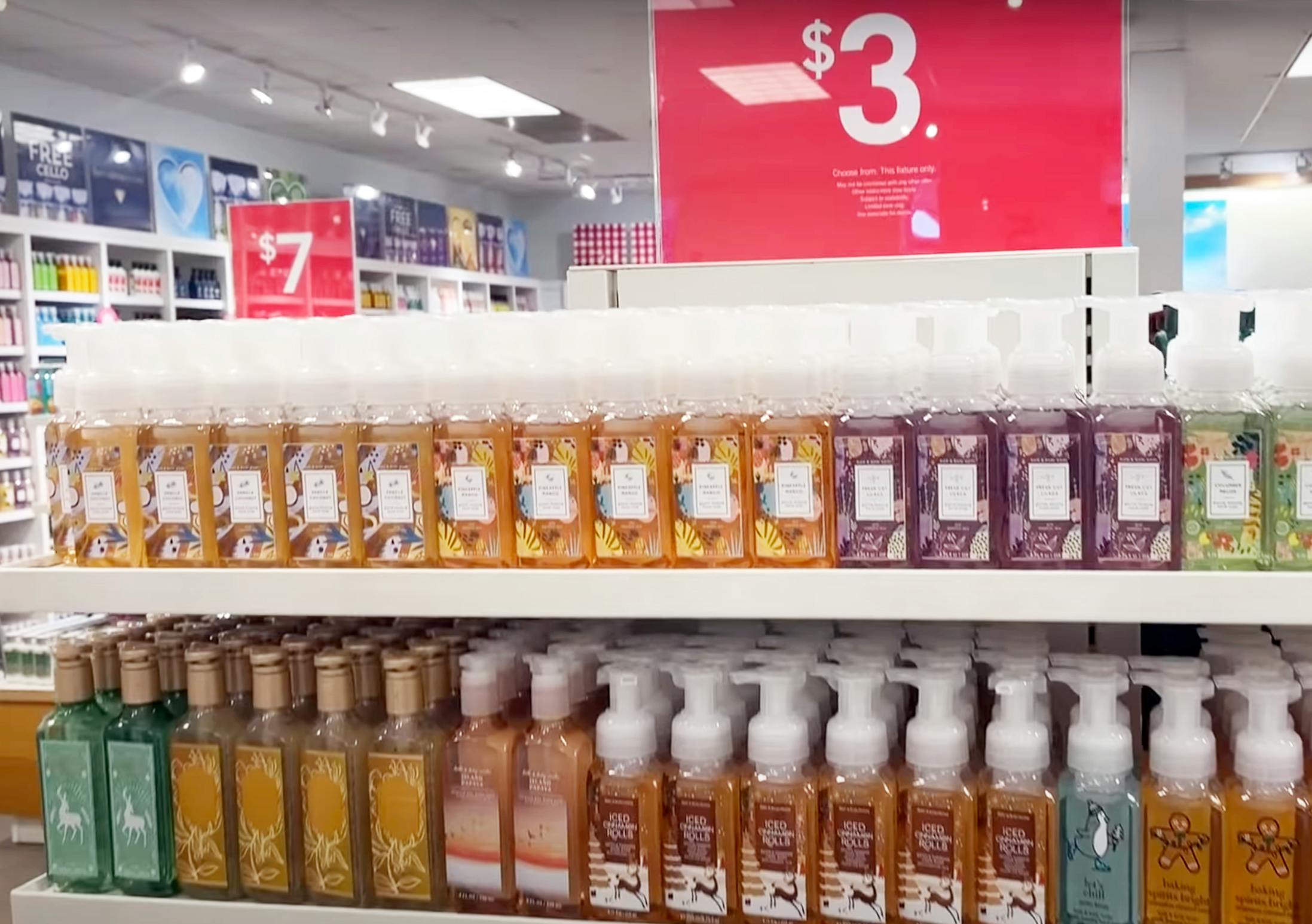 A hand soap display inside Bath & Body Works with a sign that says, "$3