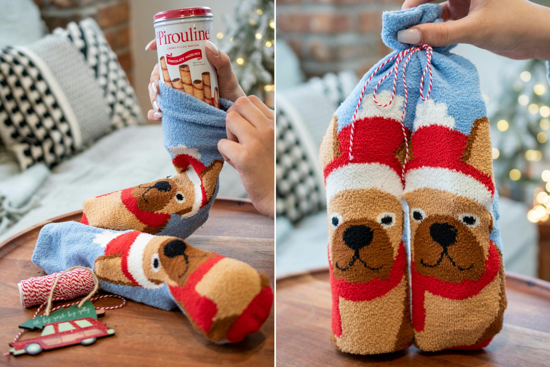 A pair of Christmas socks with dogs on them filled with goodies and tied with a bow