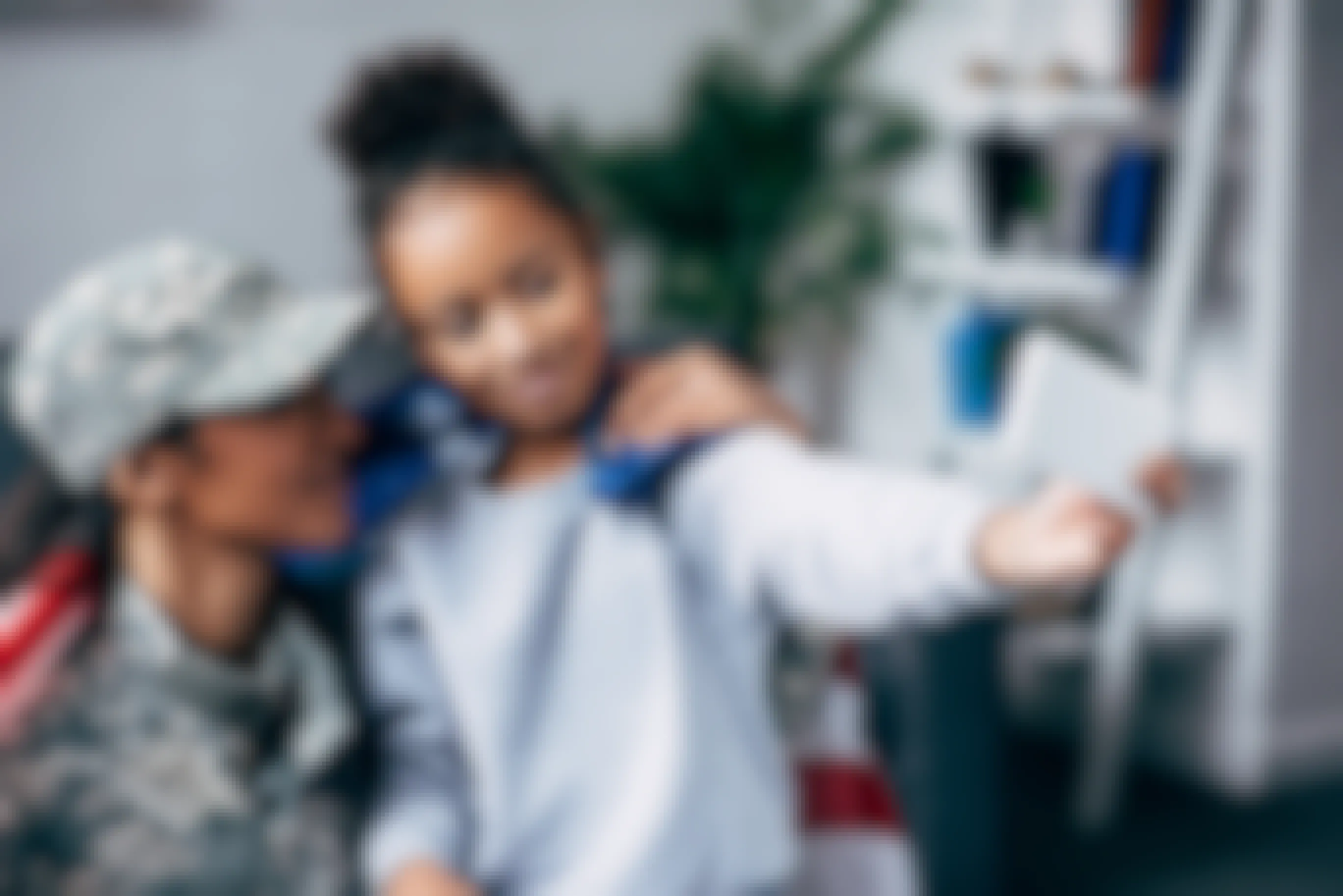 Mother in military uniform holding daughter and taking a selfie together