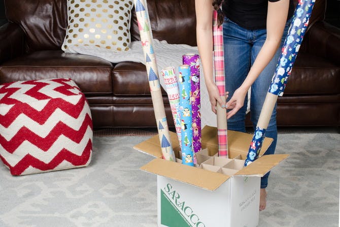 Keep wrapping paper easily accessible with a wine box.