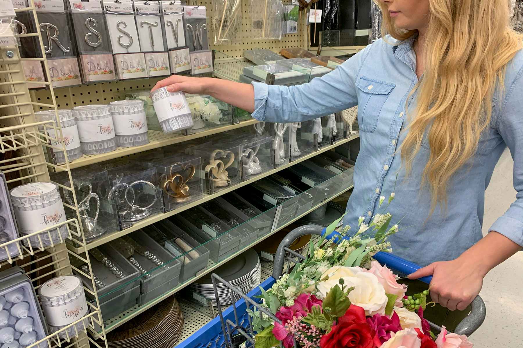 A woman picking up bubbles in the wedding section.